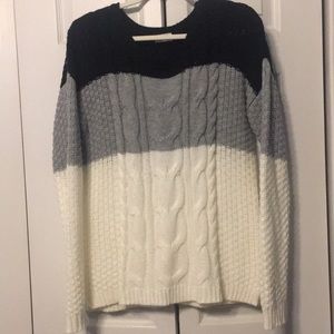 Black, gray and white sweater
